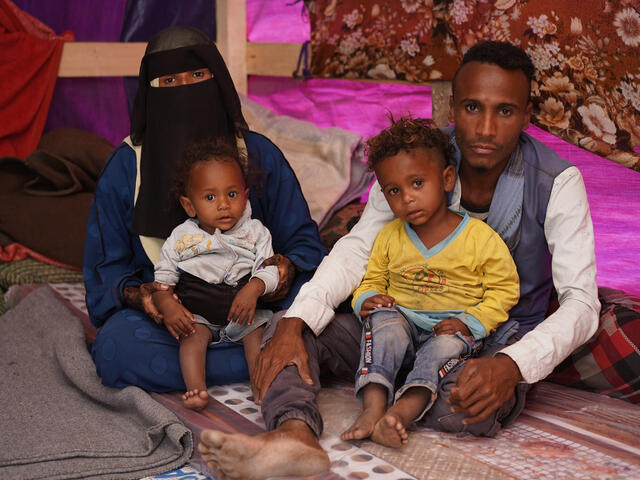 Yemeni couple Essam and Naziha with their 2 children inside a refugee camp